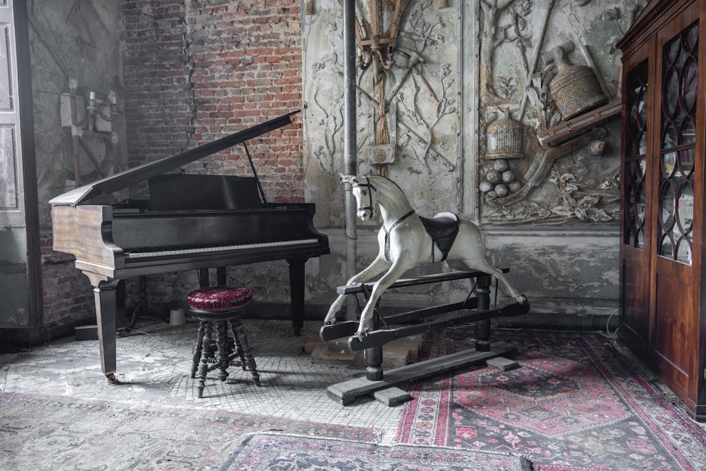 Explore a vintage room featuring a grand piano and rocking horse, perfect for artistic themes.